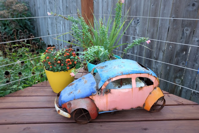 planters with rusty VW Bug