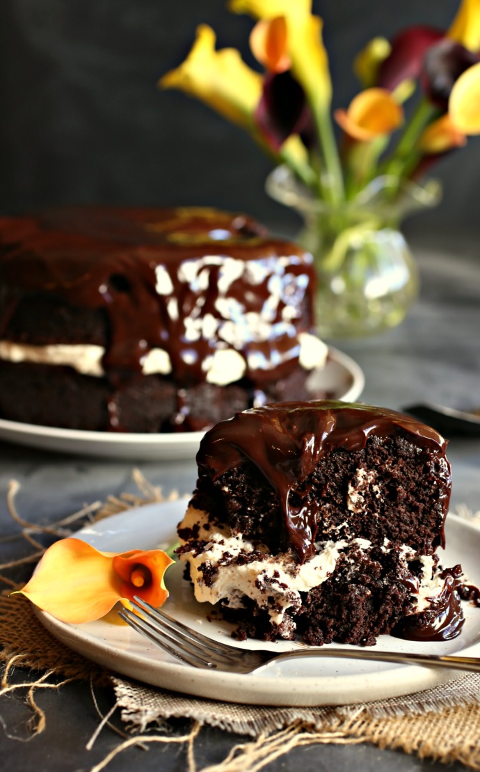 Rich, two layer deep chocolate cake with a flavorful pastry cream in the center and chocolate ganache on top.