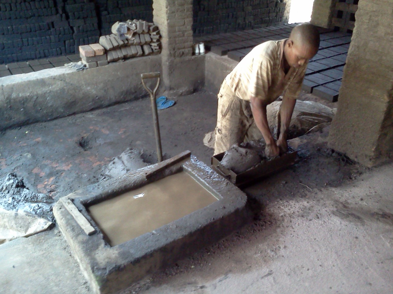 Alternative Building Construction Making production clay bricks by hand.