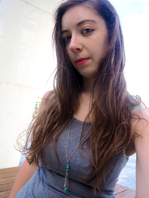On The Move | outfit jewellery details of long blue and silver pendant charm necklace