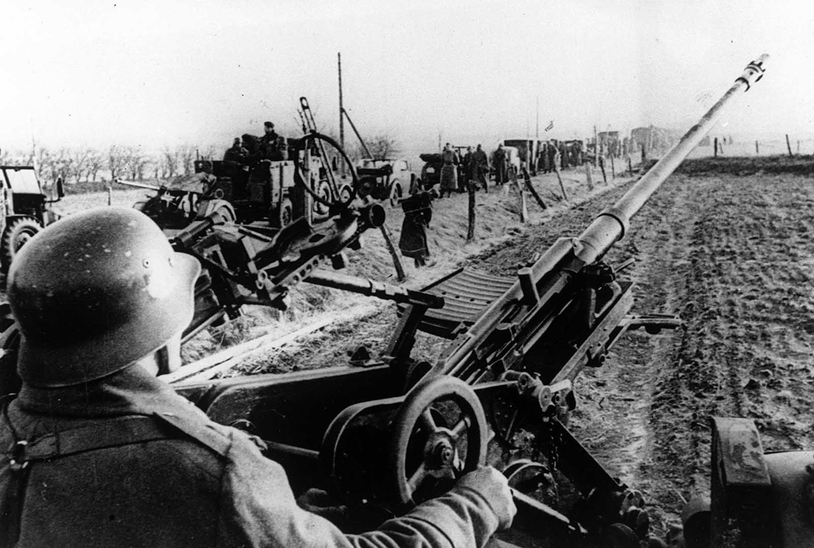 A German soldier operates his antiaircraft gun at an unknown location, in support of the German troops as they march into Danish territory, on April 9, 1940.