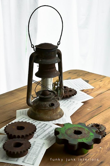 rusty gears, lantern and sheet music
