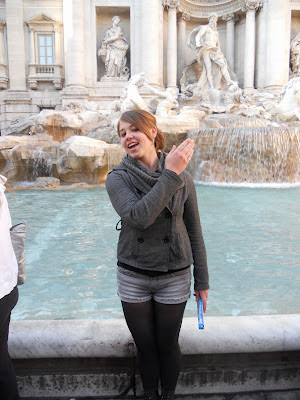 coin throwing in the trevi fountain