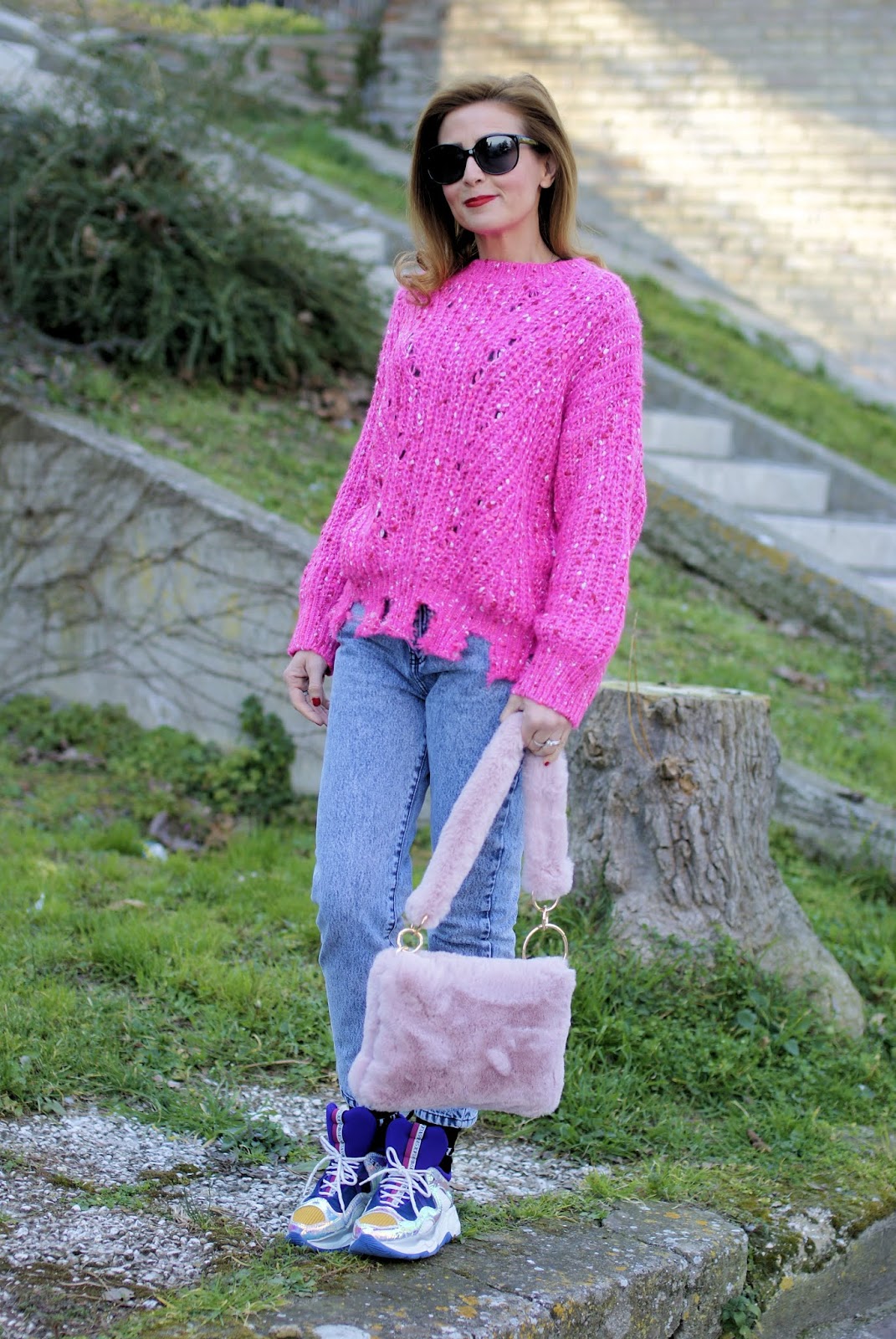 Casual outfit with a maxi distressed pink sweater and furry bag on Fashion and Cookies fashion blog