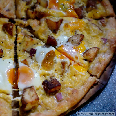 This grilled pizza recipe combines fresh eggs with roasted potatoes and a thick layer of creamy gouda cheese.