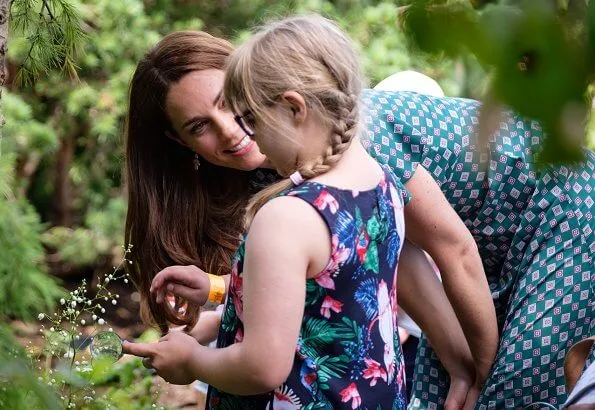 Kate Middleton wore a short sleeved printed dress by Sandro, Castaner Carina wedge, Accessorize polly petal drop earrings