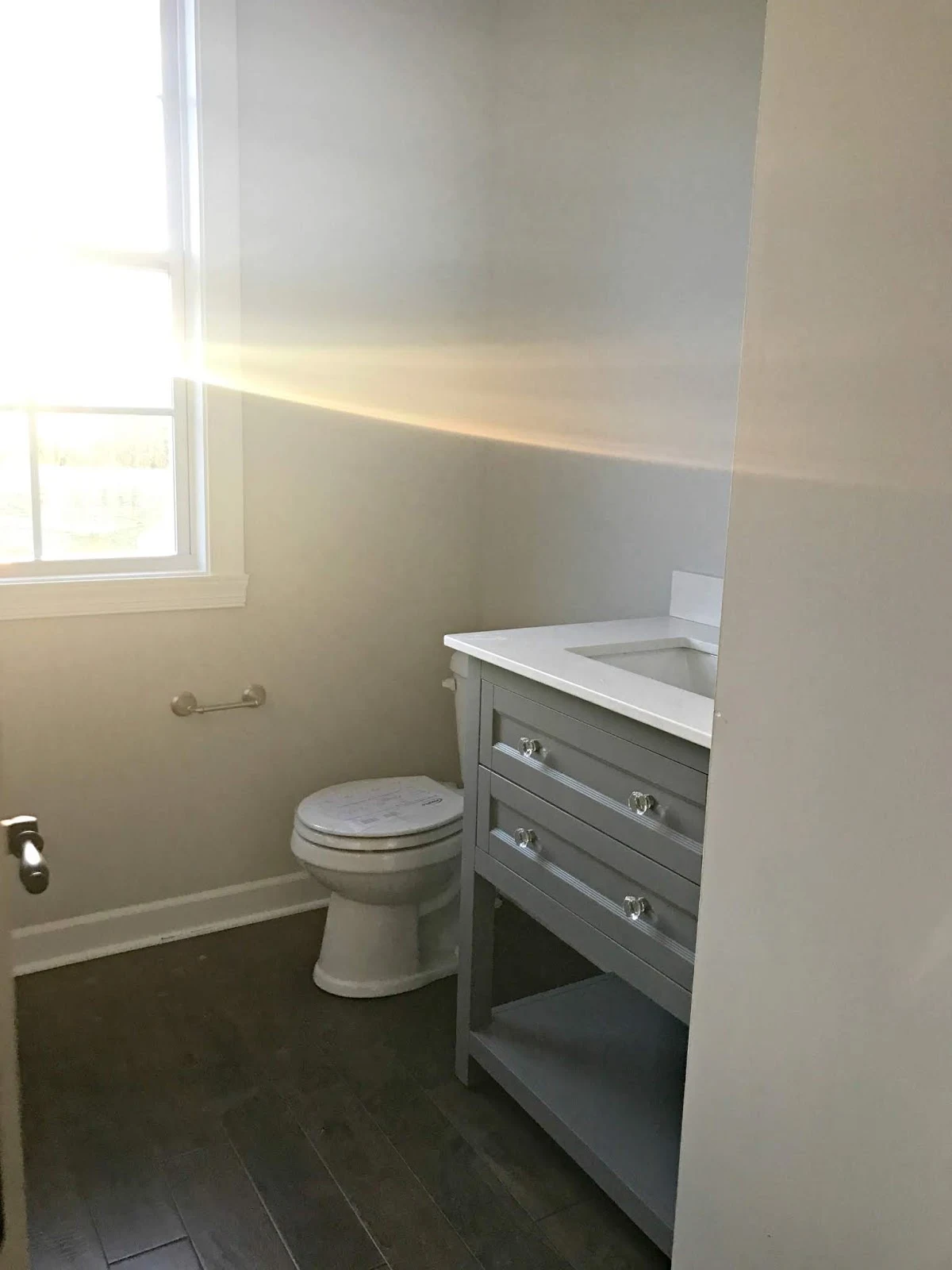 Powder room vanity with shelf and drawers