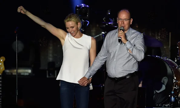 Princess Charlene of Monaco and Prince Albert II of Monaco attend the show of British singer Robbie Williams during celebrations marking Prince Albert II's decade on the throne