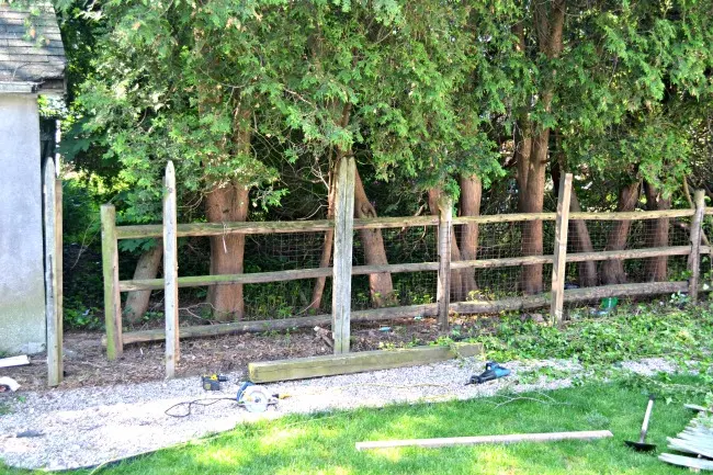 Removed fence exposing post and beam fence
