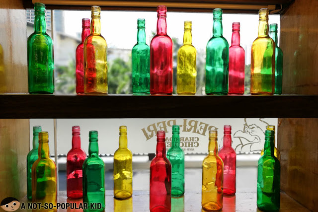 Colorful bottles at the rack - Peri-peri Chicken