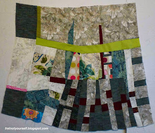 Dark blue, dark red, grey and green fabrics were used to make this improvisational quilt.