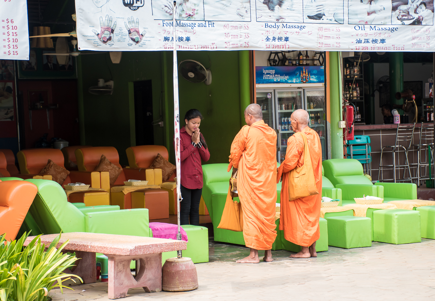 SIEM REAP MARKETS Monks praying and giving blessings in the siem reap market