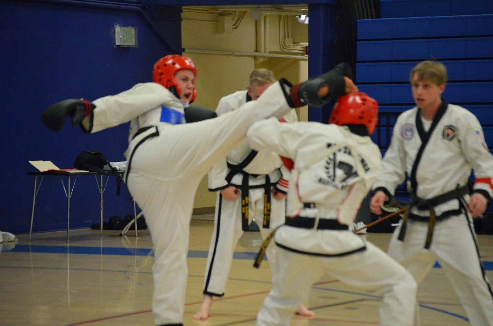 Taekwondo martial arts black belt sparring with a hook kick