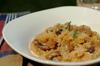 sausage risotto in white bowl