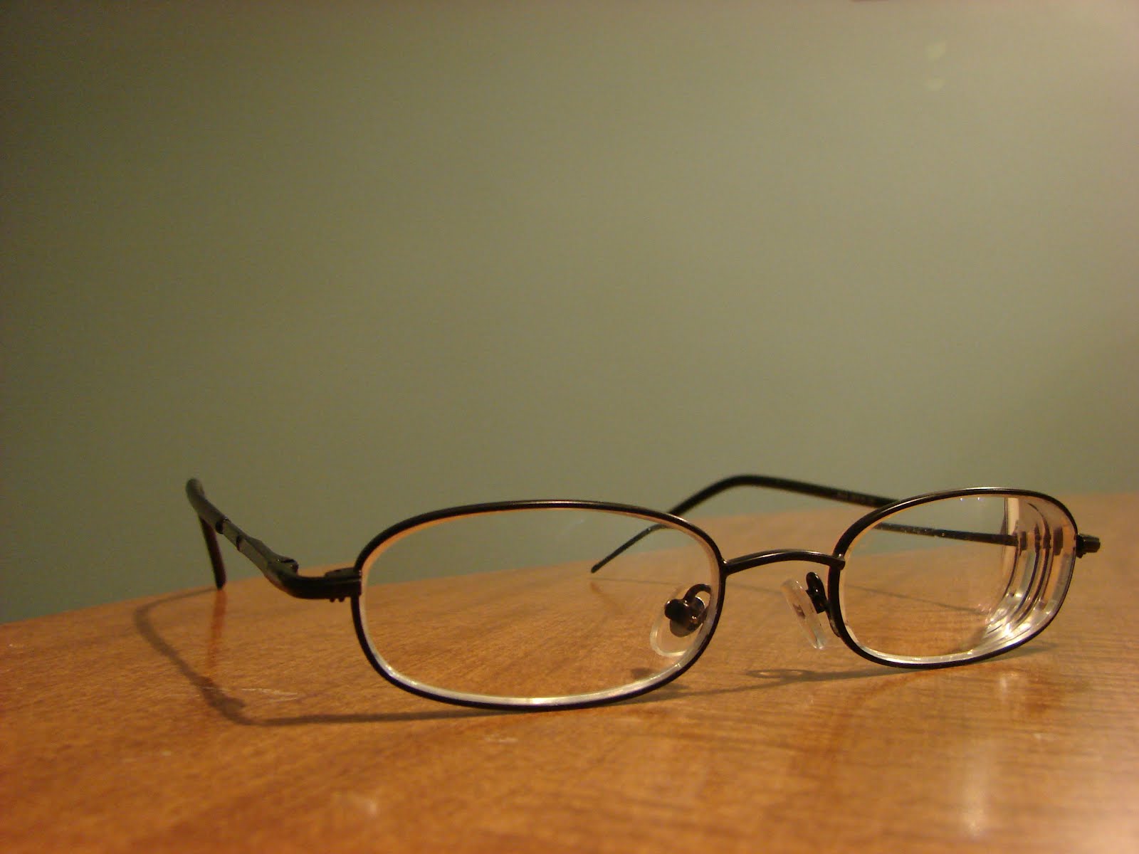 Folks, Listen! Eyeglasses on the Table