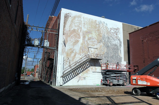 Vhils and his crew are also in Fort Smith, Arkansas where they've been working on a new piece for the first edition of the Unexpected Street Art Festival.