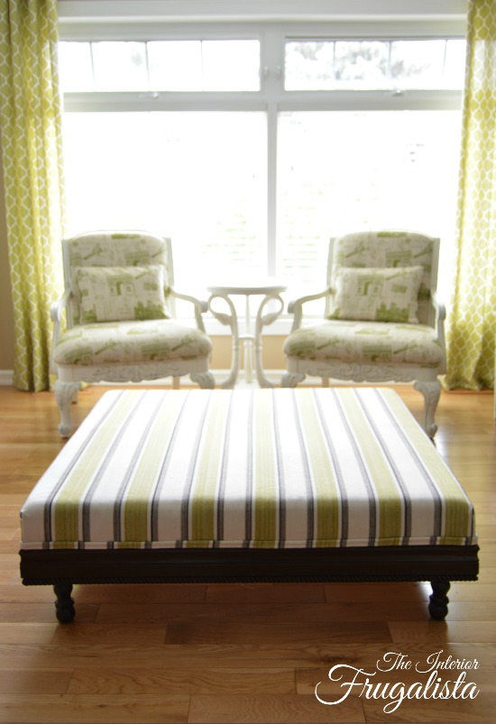 DIY Upholstered Ottoman after refreshed with green, brown, and white striped ticking fabric | The Interior Frugalista DIY Upholstered Ottoman Finished