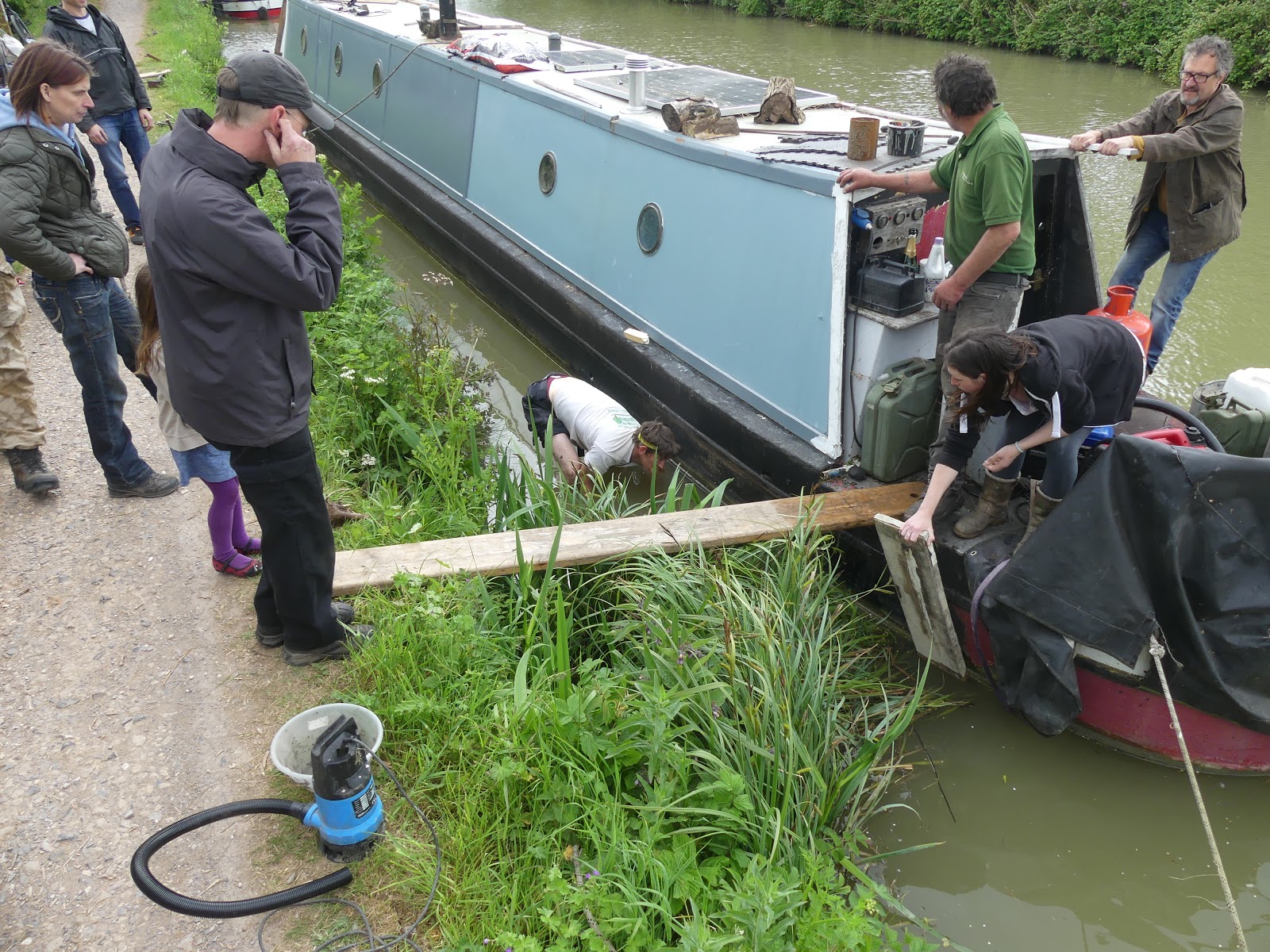 upside down in cloud rescuing a flooded boat
