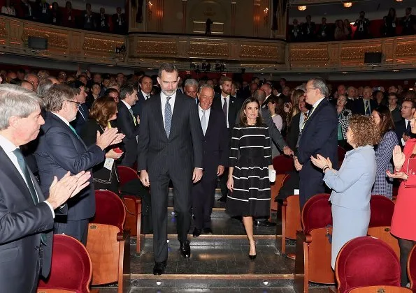 Queen Letizia wore a new flare striped cocktail dress by Carolina Herrera