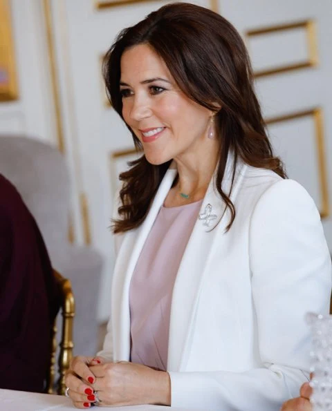 Crown Princess Mary wore Isabel Marant pink blouse, and she wore a white blazer and wear Marianne Dulong pink diamond earrings