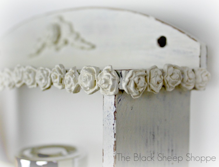 Paperclay roses adhered to borders. Paperclay roses adhered to borders.