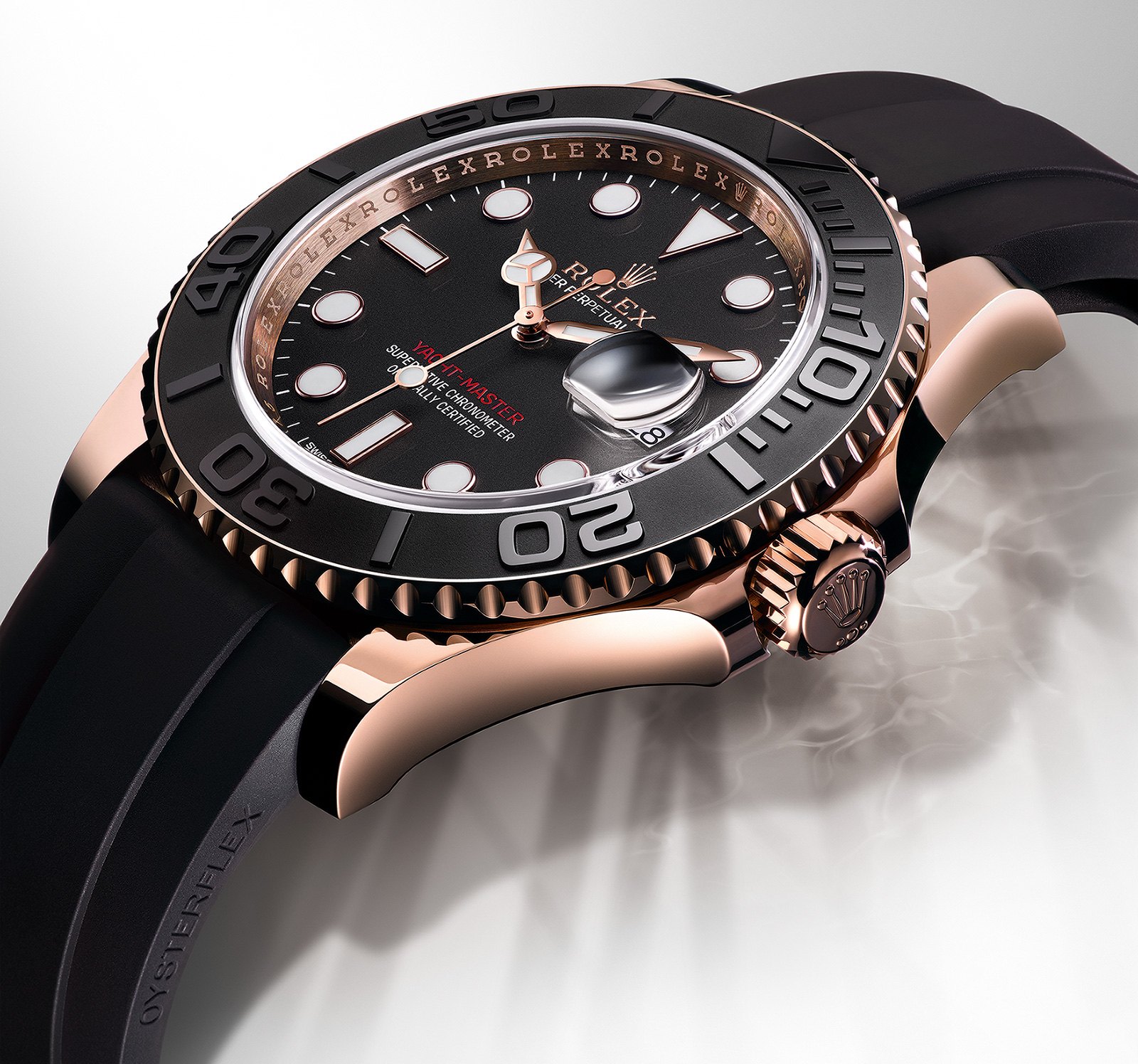 ... in a yacht master the dial is black with the rolex logo in gold along