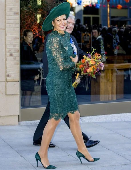 Dutch Queen Máxima attended Leidsche Rijn's 20th anniversary celebrations. Queen wore a green lace dress and pumps by Natan. diamond earrings