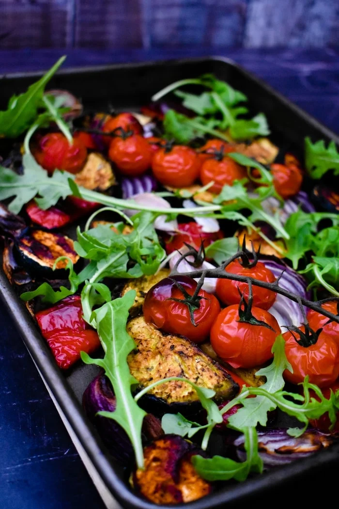 spiced roasted vegetables topped with rocket (arugula)