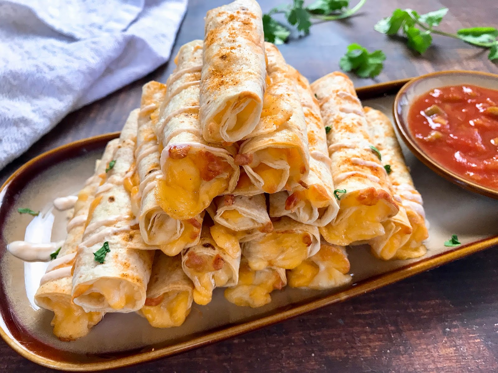 Baked Cheese Taquitos With Spicy Sour Cream