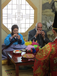 Traditional Korean wedding ceremony at wedding hall - parents drink tea