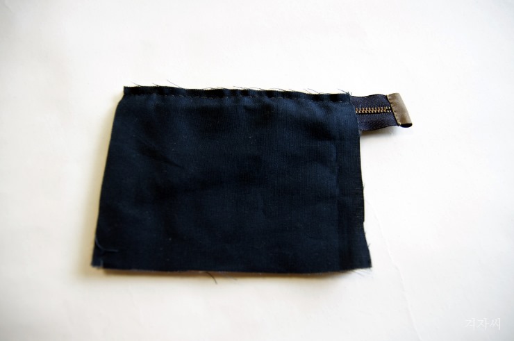 Small cosmetic pouch made of faux fur makeup bag mini wallet. Small cosmetic pouch made of faux fur makeup bag mini wallet.