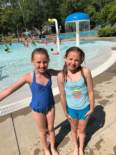 kids by pool smiling