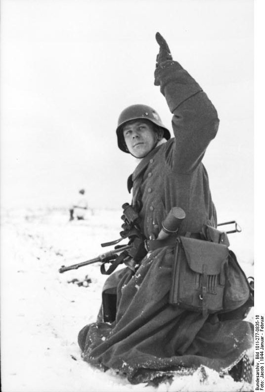 World War II History: German soldier in wintry terrain with MP 40 ...