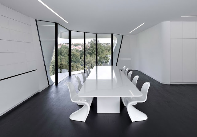 White Colored Marble Floor and Square Shaped Table Made from Shiny Wooden Material