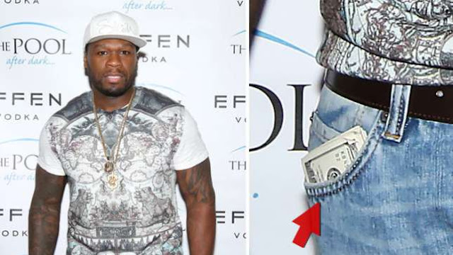 50 Cent carry a wad of fifty $100 bills in his pocket.