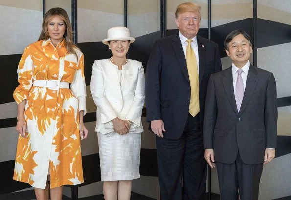 Melania Trump wore Dries van Noten floral print cotton coat. Naruhito and Empress Masako at Tokyo hotel