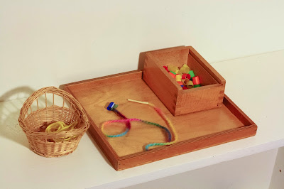 Montessori 'Necklace Making' activity tray for children