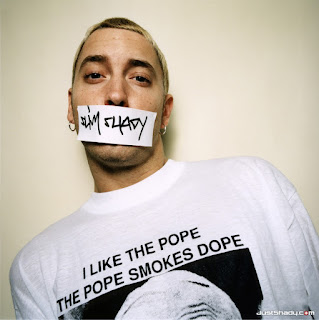 As worn by Eminem - I Like The Pope The Pope Smokes Dope shirt. PYGOD.COM