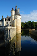 A Votre Sante! (tower of medieval castle chateau de chenonceau with protective canal in france at loire's area)