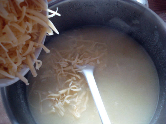 add shredded cheddar to the soup