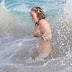 Lily Cole finally has a handle on her fashionable bikini as she swims with friends in St Barts