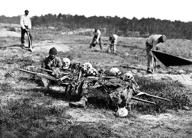 African Americans collect the remains of soldiers killed in battle near Cold Harbor, Virginia, in April of 1865.