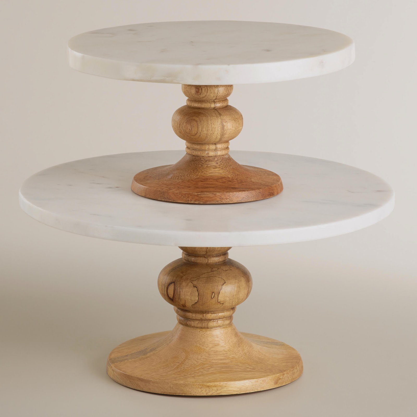 http://www.worldmarket.com/product/round+marble+and+wood+pedestal+stand.do