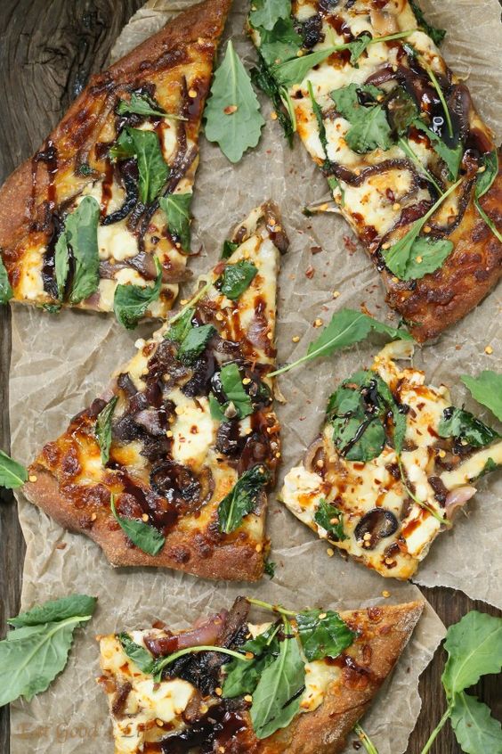 Eat Good 4 Life caramelized onion kale goat cheese pizza with balsamic drizzle. This is made with whole wheat pizza dough.