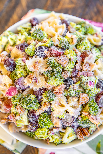 Broccoli Grape Pasta Salad - great for all your summer cookouts! SO easy to make! Broccoli, grapes, pasta, bacon, pecans, mayonnaise, sugar, red onion, red wine vinegar and salt. Can make in advance and refrigerate until ready to serve. Took this to a potluck and everyone went back for seconds. I didn't have any leftovers! #pastasalad #broccolisalad #sidedish #potluck Broccoli Grape Pasta Salad in a bowl