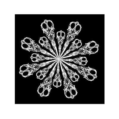 starburst of white vintage scissors on black