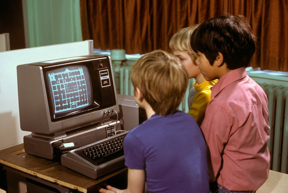 kids playing on a trs-80 computer