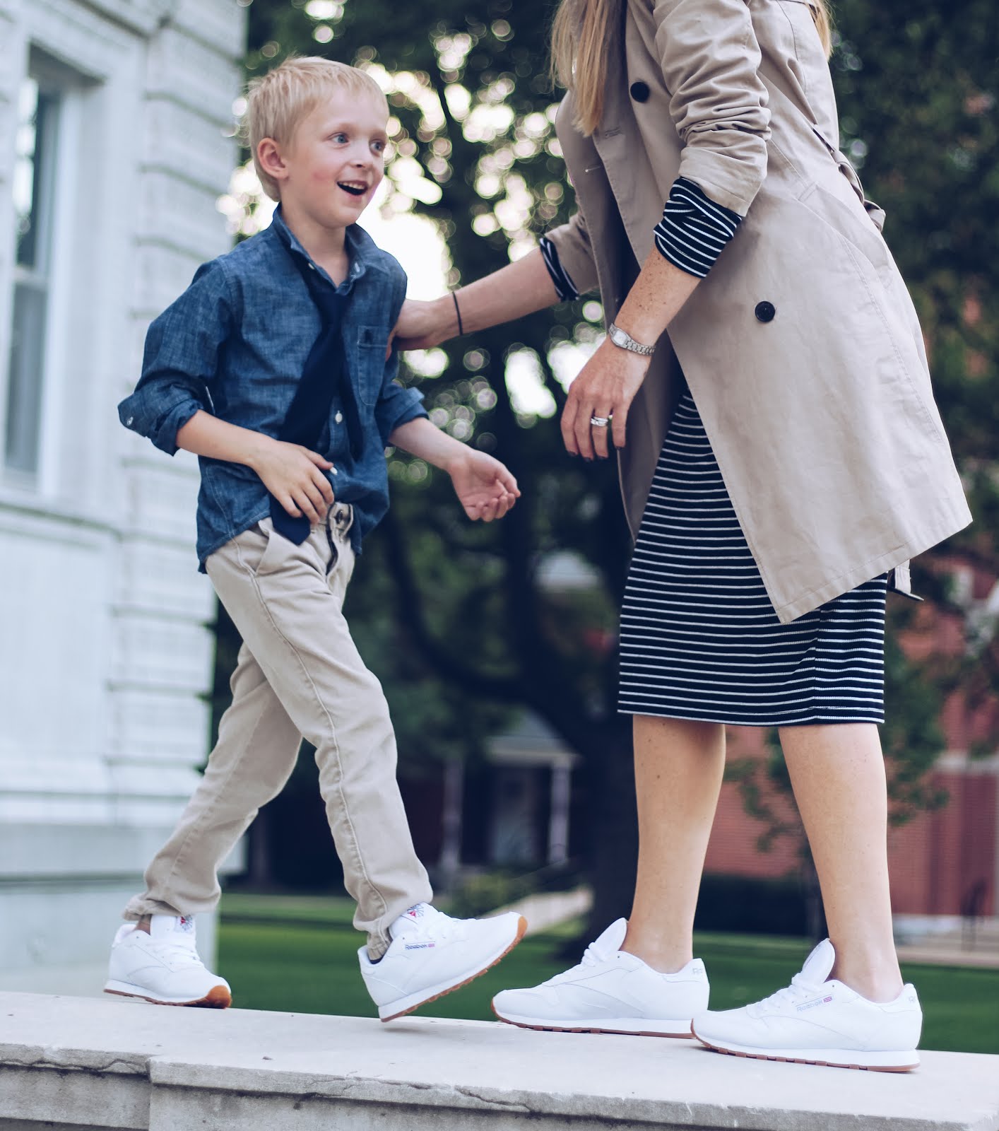 white reebok classics. mom outfit. mother son outfits. fall outfit with tennis shoes. trench coat outfit.