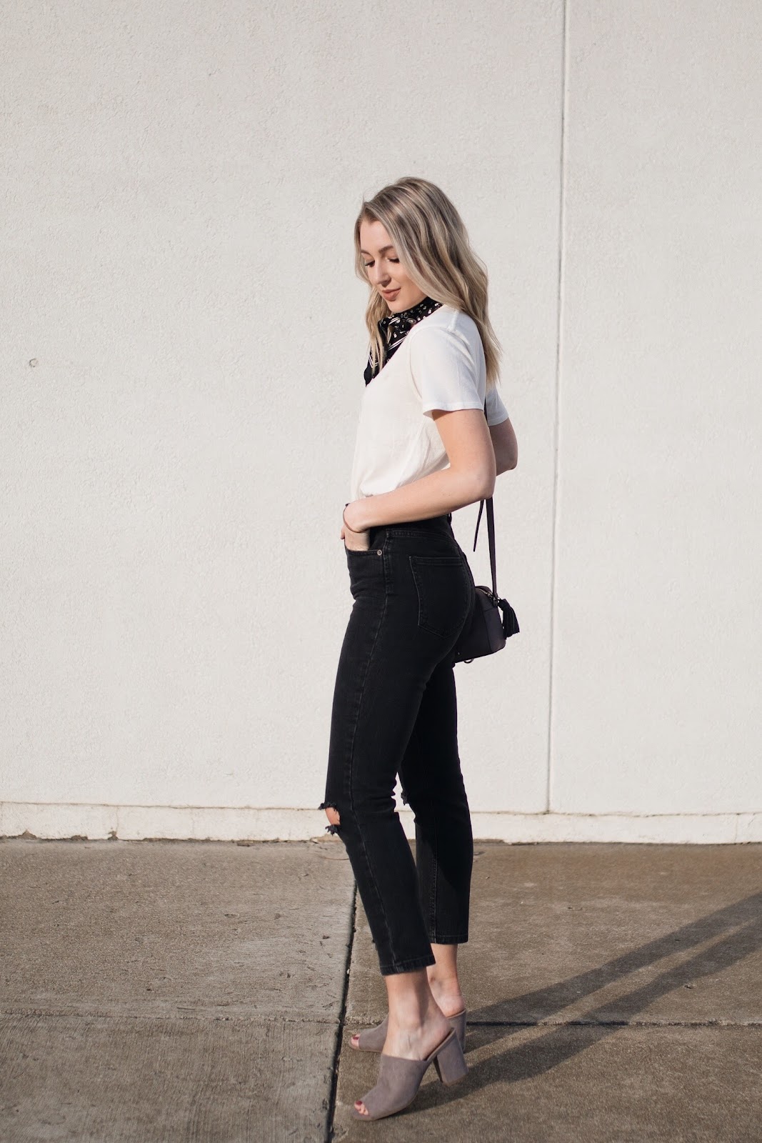 black jeans with a tucked-in white tee