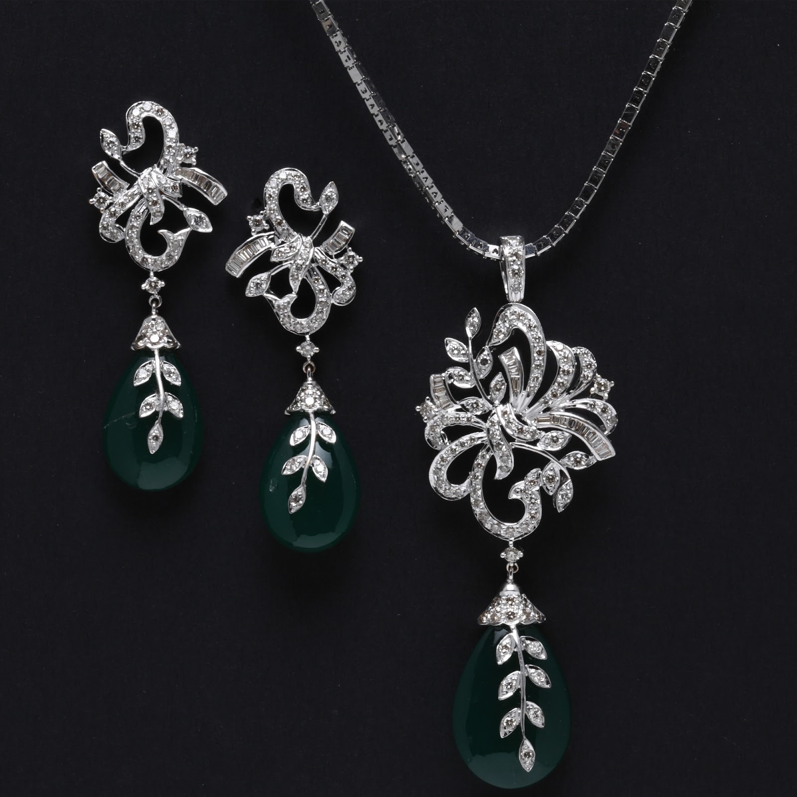 Indian Jewellery and Clothing Emerald Pendant sets from PC Jewellers..